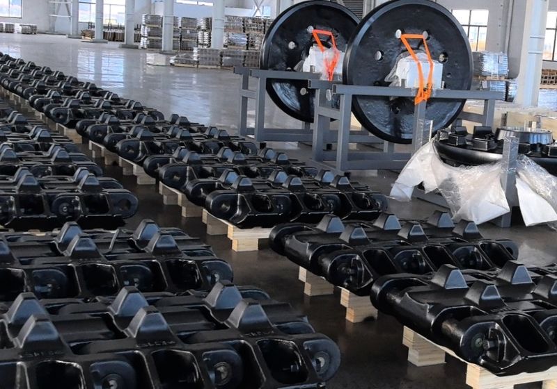 Cast track shoe assemblies and idlers on the production floor